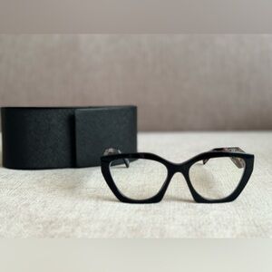 Prada black eyeglasses with neutral pink and brown tones